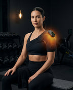 Woman wearing the heated shoulder wrap with strap on one shoulder