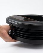 Foldable foot spa with massage rollers – folded basin held in two hands