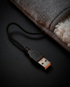 USB plug and cable of the foot warmer in detail