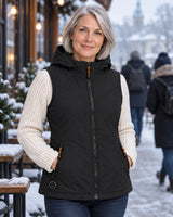 Women's heated hooded vest PyreFit Transitor on a winter day: over a sweater