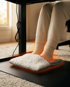 Feet in the USB foot warmer under a table