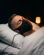 Face mask – heat or massage – man wearing the mask lying down