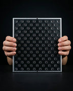 LED red light panel – panel held in two hands, front view
