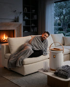 Towel warmer with lid – person next to the warmer on the sofa