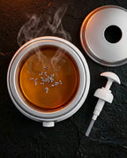Massage oil warmer with display – open container, top view